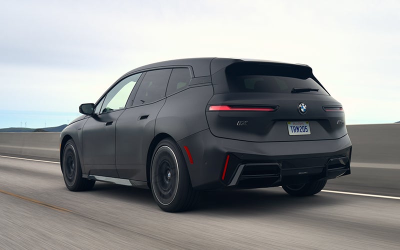 The BMW iX M70 driving rear shot. | BMW of Okemos in Okemos MI